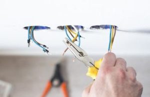 A photo of electrician littleton working on the types of electrical wiring.